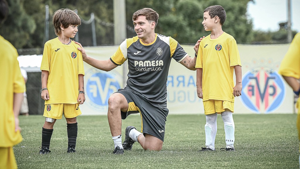 Villarreal coaches training young players on the pitch